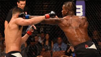 LAS VEGAS, NV - MAY 29: (R-L) Lorenz Larkin punches Jorge Masvidal in their welterweight bout during the UFC Fight Night event inside the Mandalay Bay Events Center on May 29, 2016 in Las Vegas, Nevada. (Photo by Josh Hedges/Zuffa LLC/Zuffa LLC via Getty