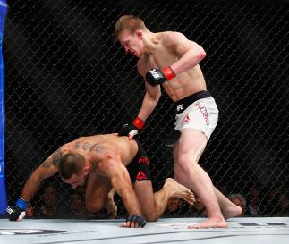 LONDON, ENGLAND - FEBRUARY 27: Arnold Allen of England (R) in action against Yaotzin Meza of USA during the Featherweight Bout of the UFC Fight Night at The O2 Arena on February 27, 2016 in London, England. (Photo by Christopher Lee/Getty Images)