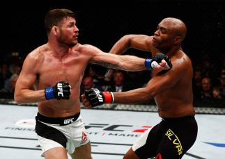 LONDON, ENGLAND - FEBRUARY 27: Anderson 'The Spider' Silva of Brazil (R) and Michael 'The Count' Bisping of England (L) compete in their Middleweight bout during the UFC Fight Night held at at Indigo at The O2 Arena on February 27, 2016 in London, Englan