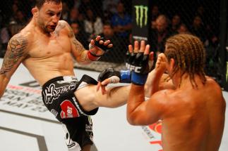 MANILA, PHILIPPINES - MAY 16: Frankie Edgar of the United States throws a kick at Uriah Faber of the United States in their featherweight fight during the UFC Fight Night event at the Mall of Asia Arena on May 16, 2015 in Manila, Philippines. (Photo by Mi