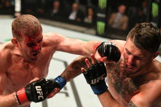 MELBOURNE, AUSTRALIA - NOVEMBER 27: (L-R) Daniel Kelly of Australia punches Chris Camozzi in their middleweight bout during the UFC Fight Night event at Rod Laver Arena on November 27, 2016 in Melbourne, Australia. (Photo by Jeff Bottari/Zuffa LLC/Zuffa