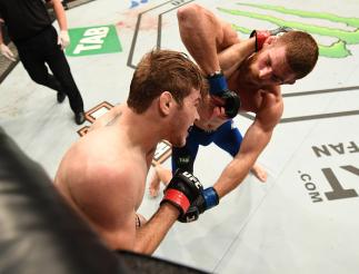 MELBOURNE, AUSTRALIA - NOVEMBER 27: (R-L) Andrew Holbrook elbows Jake Matthews of Australia in their lightweight bout during the UFC Fight Night event at Rod Laver Arena on November 27, 2016 in Melbourne, Australia. (Photo by Jeff Bottari/Zuffa LLC/Zuff