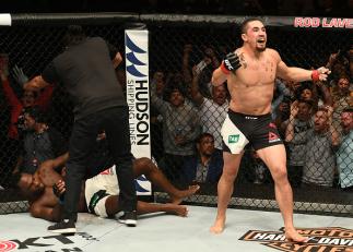 MELBOURNE, AUSTRALIA - NOVEMBER 27: Robert Whittaker of New Zealand celebrates his TKO victory over Derek Brunson in their middleweight bout during the UFC Fight Night event at Rod Laver Arena on November 27, 2016 in Melbourne, Australia. (Photo by Jeff