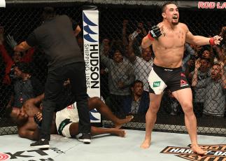 MELBOURNE, AUSTRALIA - NOVEMBER 27:   Robert Whittaker of New Zealand celebrates his TKO victory over Derek Brunson in their middleweight bout during the UFC Fight Night event at Rod Laver Arena on November 27, 2016 in Melbourne, Australia. (Photo by Jeff