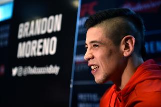 MEXICO CITY, MEXICO - AUGUST 03: Brandon Moreno of Mexico interacts with media during the UFC Ultimate Media Day at the W Hotel on August 3, 2017 in Mexico City, Mexico. (Photo by Jeff Bottari/Zuffa LLC/Zuffa LLC via Getty Images)