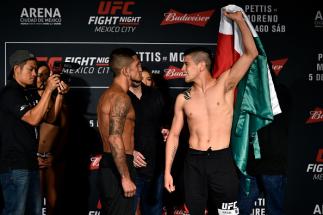 MEXICO CITY, MEXICO - AUGUST 04: (L-R) Sergio Pettis of the United States and Brandon Moreno of Mexico face off during the UFC Fight Night weigh-in inside the W Hotel on August 4, 2017 in Mexico City, Mexico. (Photo by Jeff Bottari/Zuffa LLC/Zuffa LLC vi