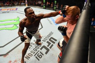 NASHVILLE, TN - AUGUST 08: (L-R) Derek Brunson punches Sam Alvey in their middleweight bout during the UFC Fight Night event at Bridgestone Arena on August 8, 2015 in Nashville, Tennessee. (Photo by Josh Hedges/Zuffa LLC/Zuffa LLC via Getty Images)