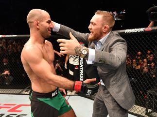 BELFAST, NORTHERN IRELAND - NOVEMBER 19: (L-R) Artem Lobov of Russia celebrates with teammate and UFC champion Conor McGregor after his featherweight bout against Teruto Ishihara during the UFC Fight Night at the SSE Arena on November 19, 2016 in Belfast