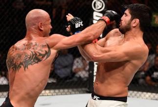 OTTAWA, ON - JUNE 18: (L-R) Donald Cerrone of the United States punches Patrick Cote of Canada in their welterweight bout during the UFC Fight Night event inside the TD Place Arena on June 18, 2016 in Ottawa, Ontario, Canada. (Photo by Jeff Bottari/Zuff