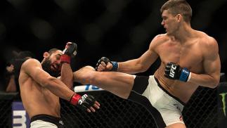LAS VEGAS, NEVADA - FEBRUARY 06: (R-L) Stephen Thompson kicks Johny Hendricks in their welterweight bout during the UFC Fight Night Las Vegas: Hendricks vs Thompson event inside MGM Grand Garden Arena on February 6, 2016 in Las Vegas Nevada. (Photo by B