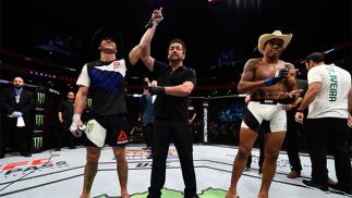 PITTSBURGH, PA - FEBRUARY 21: (L-R) Donald Cerrone celebrates his submission victory over Alex Oliveira in their welterweight bout during the UFC Fight Night event at Consol Energy Center on February 21, 2016 in Pittsburgh, Pennsylvania. (Photo by Jeff Bo