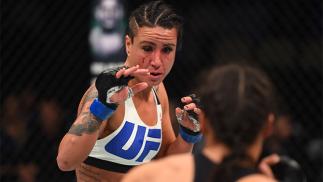 PITTSBURGH, PA - FEBRUARY 21: (L-R) Ashlee Evans-Smith circles Marion Reneau in their women's bantamweight bout during the UFC Fight Night event at Consol Energy Center on February 21, 2016 in Pittsburgh, Pennsylvania. (Photo by Jeff Bottari/Zuffa LLC/Zuf