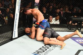 PITTSBURGH, PA - SEPTEMBER 16: (L-R) Luke Rockhold controls the body and punches David Branch in their middleweight bout during the UFC Fight Night event inside the PPG Paints Arena on September 16, 2017 in Pittsburgh, Pennsylvania. (Photo by Josh Hedges