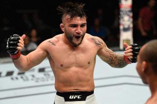 PORTLAND, OR - OCTOBER 01:  (L-R) John Lineker of Brazil reacts to John Dodson in their bantamweight bout during the UFC Fight Night event at the Moda Center on October 1, 2016 in Portland, Oregon. (Photo by Josh Hedges/Zuffa LLC/Zuffa LLC via Getty Image