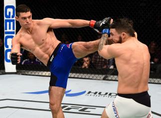 SACRAMENTO, CA - DECEMBER 17: (L-R) Alan Jouban kicks Mike Perry in their welterweight bout during the UFC Fight Night event inside the Golden 1 Center Arena on December 17, 2016 in Sacramento, California. (Photo by Jeff Bottari/Zuffa LLC/Zuffa LLC via G