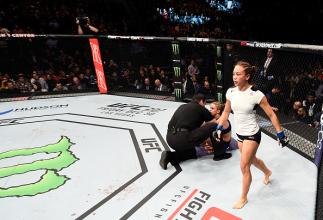 SACRAMENTO, CA - DECEMBER 17: Michelle Waterson celebrates after her submission victory over Paige VanZant in their women's strawweight bout during the UFC Fight Night event inside the Golden 1 Center Arena on December 17, 2016 in Sacramento, California.