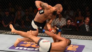 SAN DIEGO, CA - JULY 15: Sam Sicilia (top) punches Yaotzin Meza in their featherweight bout during the UFC event at the Valley View Casino Center on July 15, 2015 in San Diego, California. (Photo by Jeff Bottari/Zuffa LLC/Zuffa LLC via Getty Images)