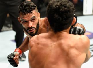 LAS VEGAS, NV - JULY 08: (L-R) Rob Font punches Douglas Silva de Andrade of Brazil in their bantamweight bout during the UFC 213 event at T-Mobile Arena on July 8, 2017 in Las Vegas, Nevada. (Photo by Josh Hedges/Zuffa LLC/Zuffa LLC via Getty Images)