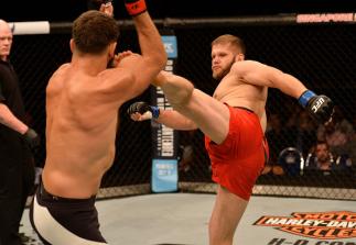 SINGAPORE - JUNE 17: (R-L) Marcin Tybura of Poland kicks Andrei Arlovski of Belarus in their heavyweight bout during the UFC Fight Night event at the Singapore Indoor Stadium on June 17, 2017 in Singapore. (Photo by Brandon Magnus/Zuffa LLC/Zuffa LLC vi
