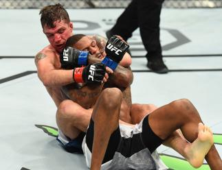 ST. LOUIS, MO - JANUARY 14: (L-R) Darren Elkins attempts to submit Michael Johnson in their featherweight bout during the UFC Fight Night event inside the Scottrade Center on January 14, 2018 in St. Louis, Missouri. (Photo by Josh Hedges/Zuffa LLC/Zuffa