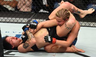 ST. LOUIS, MO - JANUARY 14:  (L-R) Jessica-Rose Clark of Australia attempts to submit Paige VanZant in their women's flyweight bout during the UFC Fight Night event inside the Scottrade Center on January 14, 2018 in St. Louis, Missouri. (Photo by Josh Hed