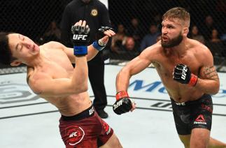 ST. LOUIS, MO - JANUARY 14: (R-L) Jeremy Stephens punches Dooho Choi of South Korea in their featherweight bout during the UFC Fight Night event inside the Scottrade Center on January 14, 2018 in St. Louis, Missouri. (Photo by Josh Hedges/Zuffa LLC/Zuffa
