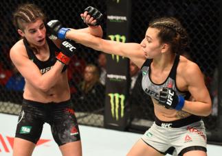 SYDNEY, AUSTRALIA - NOVEMBER 19:  (R-L) Nadia Kassem punches Alex Chambers of Australia in their women's strawweight bout during the UFC Fight Night event inside the Qudos Bank Arena on November 19, 2017 in Sydney, Australia. (Photo by Josh Hedges/Zuffa L