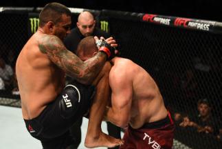 SYDNEY, AUSTRALIA - NOVEMBER 19: (L-R) Fabricio Werdum of Brazil knees Marcin Tybura of Poland in their heavyweight bout during the UFC Fight Night event inside the Qudos Bank Arena on November 19, 2017 in Sydney, Australia. (Photo by Josh Hedges/Zuffa L
