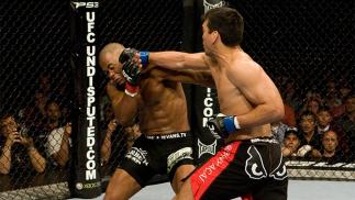 LAS VEGAS - MAY 23: Lyoto Machida (black/red shorts) def. Rashad Evans (black tight shorts) - KO 3:57 round 2 during UFC 98 at MGM Grand Arena on May 23, 2009 in Las Vegas, Nevada. (Photo by Josh Hedges/Zuffa LLC via Getty Images)