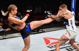 VANCOUVER, BC - AUGUST 27: (L-R) Paige VanZant of the United States kicks Bec Rawlings of Australia in their women's strawweight bout during the UFC Fight Night event at Rogers Arena on August 27, 2016 in Vancouver, British Columbia, Canada. (Photo by Je