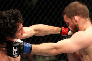 EAST RUTHERFORD, NJ - MAY 05: Roland Delorme (L) punches Nick Denis (R) during thier Bantamweight bout at Izod Center on May 5, 2012 in East Rutherford, New Jersey. (Photo by Josh Hedges/Zuffa LLC/Zuffa LLC via Getty Images)