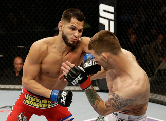 SAN JOSE, CA - APRIL 20: (L-R) Jorge Masvidal punches Tim Means in their lightweight bout during the UFC on FOX event at the HP Pavilion on April 20, 2013 in San Jose, California. (Photo by Ezra Shaw/Zuffa LLC/Zuffa LLC via Getty Images) *** Local Cap