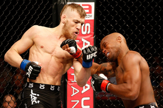 STOCKHOLM, SWEDEN - APRIL 06: (L-R) Conor McGregor punches Marcus Brimage in their featherweight fight at the Ericsson Globe Arena on April 6, 2013 in Stockholm, Sweden. (Photo by Josh Hedges/Zuffa LLC/Zuffa LLC via Getty Images)