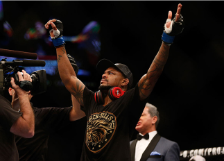 LAS VEGAS, NV - DECEMBER 28: Michael Johnson reacts to his victory over Gleison Tibau in their lightweight bout during the UFC 168 event at the MGM Grand Garden Arena on December 28, 2013 in Las Vegas, Nevada. (Photo by Josh Hedges/Zuffa LLC/Zuffa LLC vi