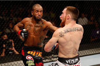 SACRAMENTO, CA - DECEMBER 14: (L-R) Bobby Green punches Pat Healy in their lightweight bout during the UFC on FOX event at Sleep Train Arena on December 14, 2013 in Sacramento, California. (Photo by Josh Hedges/Zuffa LLC/Zuffa LLC via Getty Images) *** L