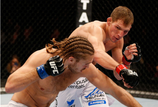 MANCHESTER, ENGLAND - OCTOBER 26: (R-L) Luke Barnatt punches Andrew Craig in their middleweight bout during the UFC Fight Night event at Phones 4 U Arena on October 26, 2013 in Manchester, England. (Photo by Josh Hedges/Zuffa LLC/Zuffa LLC via Getty Imag