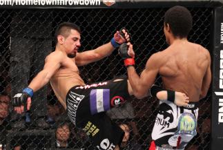 LAS VEGAS, NV - FEBRUARY 04: Edwin Figueroa (left) kicks Alex Caceres during the UFC 143 event at Mandalay Bay Events Center on February 4, 2012 in Las Vegas, Nevada. (Photo by Nick Laham/Zuffa LLC/Zuffa LLC via Getty Images) *** Local Caption *** Edwin