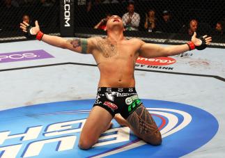 ATLANTA, GA - APRIL 21: Travis Browne celebrates defeating Chad Griggs by tap out from an arm triangle during their heavyweight bout for UFC 145 at Philips Arena on April 21, 2012 in Atlanta, Georgia. (Photo by Al Bello/Zuffa LLC/Zuffa LLC via Getty Ima