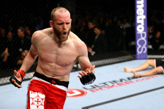 CHICAGO, IL - JANUARY 26: TJ Grant celebrates after defeating Matt Wiman during their Lightweight Bout part of UFC on FOX at United Center on January 26, 2013 in Chicago, Illinois. (Photo by Al Bello/Zuffa LLC/Zuffa LLC Via Getty Images)