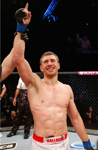 BELO HORIZONTE, BRAZIL - SEPTEMBER 04:  Piotr Hallmann reacts after his submission victory over Francisco Trinaldo in their lightweight fight during the UFC on FOX Sports 1 event at Mineirinho Arena on September 4, 2013 in Belo Horizonte, Brazil. (Photo b