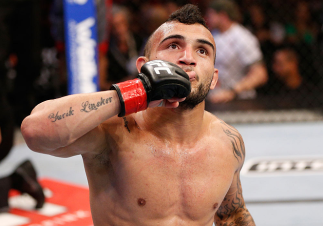 RIO DE JANEIRO, BRAZIL - AUGUST 03: John Lineker reacts after his knockout victory over Jose Maria in their flyweight bout during UFC 163 at HSBC Arena on August 3, 2013 in Rio de Janeiro, Brazil. (Photo by Josh Hedges/Zuffa LLC/Zuffa LLC via Getty Image