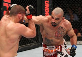 SYDNEY, AUSTRALIA - MARCH 03: (R-L) Constantinos Philippou punches Court McGee in a middleweight bout during the UFC on FX event at Allphones Arena on March 3, 2012 in Sydney, Australia. (Photo by Josh Hedges/Zuffa LLC/Zuffa LLC via Getty Images) *** Lo