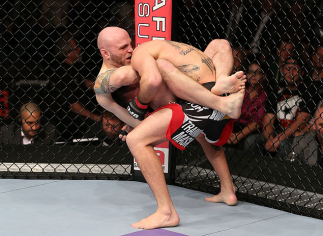 MINNEAPOLIS, MN - OCTOBER 05: (L-R) Justin Edwards secures a guillotine choke submission to defeat Josh Neer during their welterweight fight at the UFC on FX event at Target Center on October 5, 2012 in Minneapolis, Minnesota. (Photo by Josh Hedges/Zuff
