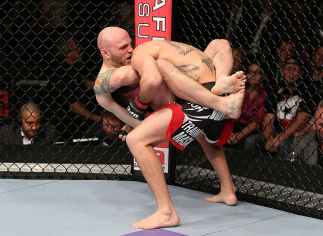 MINNEAPOLIS, MN - OCTOBER 05:  (L-R) Justin Edwards secures a guillotine choke submission to defeat Josh Neer during their welterweight fight at the UFC on FX event at Target Center on October 5, 2012 in Minneapolis, Minnesota.  (Photo by Josh Hedges/Zuff