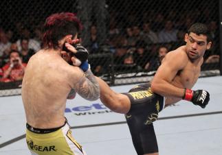 LAS VEGAS, NV - FEBRUARY 04: Renan Barao (right) kicks Scott Jorgensen during the UFC 143 event at Mandalay Bay Events Center on February 4, 2012 in Las Vegas, Nevada. (Photo by Nick Laham/Zuffa LLC/Zuffa LLC via Getty Images) *** Local Caption *** Rena
