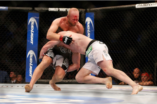 HOUSTON, TEXAS - OCTOBER 19: (R-L) CB Dollaway takes down Tim Boetsch in their UFC middleweight bout at the Toyota Center on October 19, 2013 in Houston, Texas. (Photo by Josh Hedges/Zuffa LLC/Zuffa LLC via Getty Images)