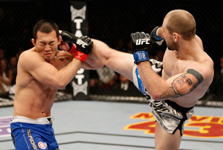 LAS VEGAS, NV - DECEMBER 29: (R-L) Alan Belcher kicks Yushin Okami during their middleweight fight at UFC 155 on December 29, 2012 at MGM Grand Garden Arena in Las Vegas, Nevada. (Photo by Josh Hedges/Zuffa LLC/Zuffa LLC via Getty Images) *** Local Capti