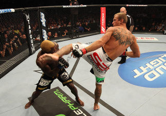 DENVER, CO - AUGUST 11: (R-L) Donald "Cowboy" Cerrone kicks Melvin Guillard during their lightweight bout at UFC 150 inside Pepsi Center on August 11, 2012 in Denver, Colorado. (Photo by Nick Laham/Zuffa LLC/Zuffa LLC via Getty Images)