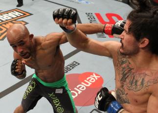 SYDNEY, AUSTRALIA - MARCH 03: (L-R) Demetrious Johnson and Ian McCall trade punches in a flyweight bout during the UFC on FX event at Allphones Arena on March 3, 2012 in Sydney, Australia. (Photo by Josh Hedges/Zuffa LLC/Zuffa LLC via Getty Images) ***