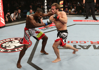 NOTTINGHAM, ENGLAND - SEPTEMBER 29:  (R-L) Brad Pickett knocks out Yves Jabouin with an uppercut during their bantamweight fight at the UFC on Fuel TV event at Capital FM Arena on September 29, 2012 in Nottingham, England.  (Photo by Josh Hedges/Zuffa LLC